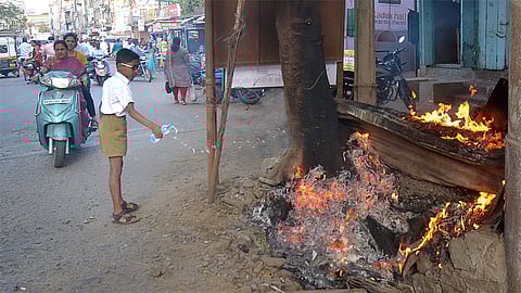 School Boy Effort To Control Fire Of Burning Tree