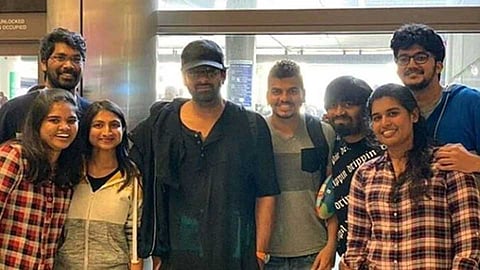 Actor prabhas slapped by crazy fan after taking a photo