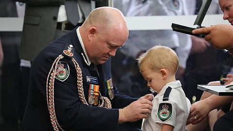 Firefighter lost life in australia fire son received posthumously bravery award