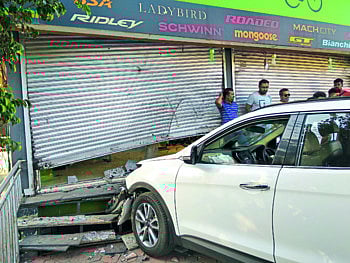 Bhardhaw broke into the car shop and ...