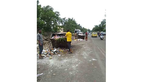 trash around the common dustbin for public at sangvi