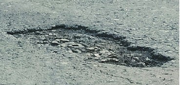 Pits on the highway with a single rain