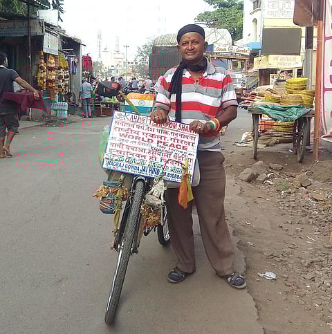 Nagraj Gowda preaching the message of world peace on a bicycle
