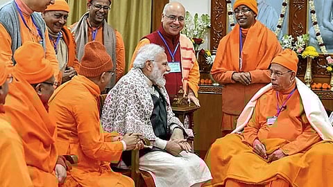 PM Modi forgot to remove the shoes when he went to the belur math headquarters of ramakrishna mission