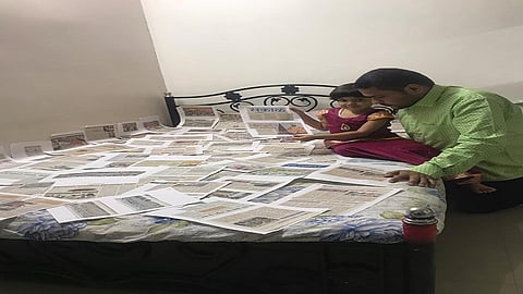 a man get experience of Wari by seeing news clippings from Sakal Newspaper of last year.jpg