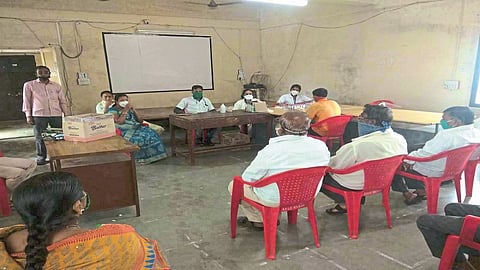 Keep social distance, distribute ration grains