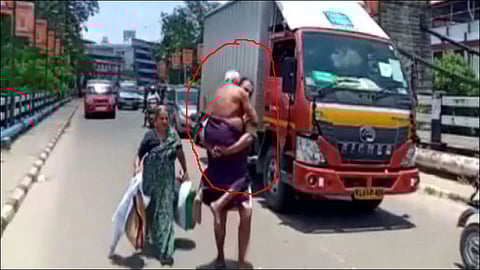 kerala man carries ailing father on shoulders after police stop vehicle over lockdown