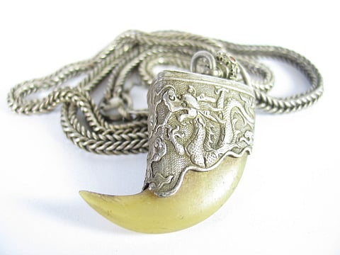 The villager who went to renew the locket from the tiger claw was burnt