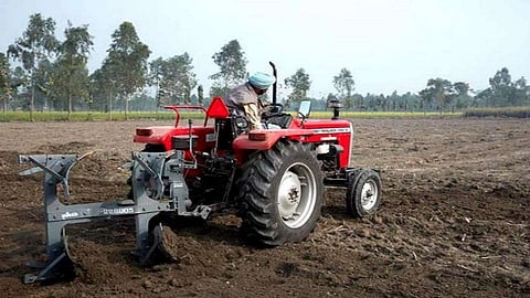 farmer cut all  crops using tractor in farm