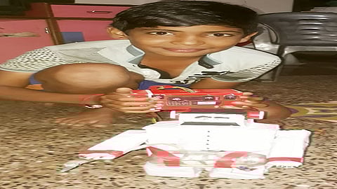 during lockdown period 7th standard boy prepare a robot who spray sanitizer