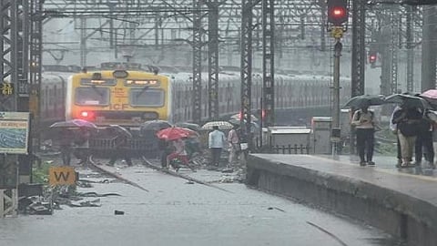 mumbai rain update local train affect due to rain latemark railway traffic jam