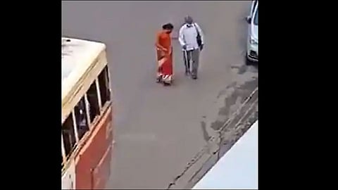 woman helping blind man during corona virus video viral