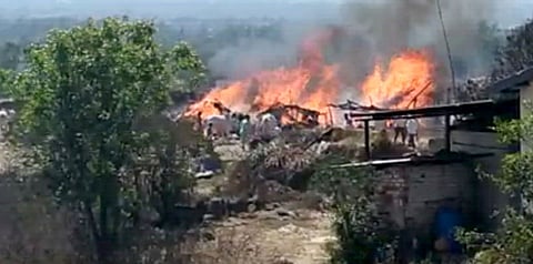 fire in huts in sugar cane worker