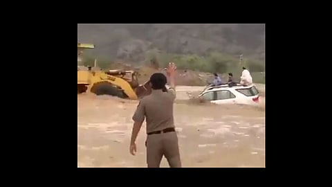 jcb rescued 3 people trapped in the flood video viral