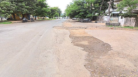 Asphalt on one side of the road, carved on the other