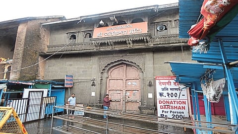People are waiting for the opening of the temple at Trimbakeshwar