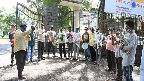 kolhapur district administration by protesting in front of the Collector office with various musical instruments