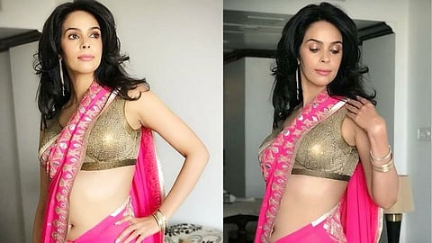 bollywood actor mallika sherawat did a photoshoot in a pink colored saree.jpg