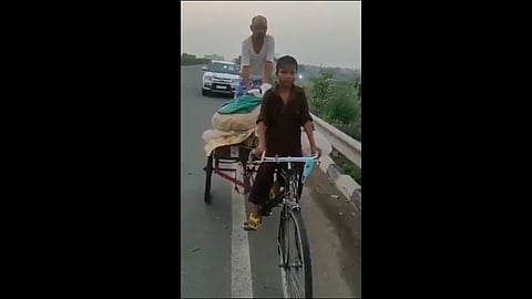 lockdown 11 years old boy riding a cycle cart carrying his parents video viral