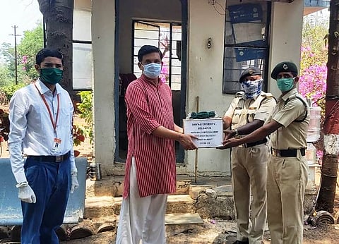 Distribution of pest by sanitizer and mask at Shivaji University