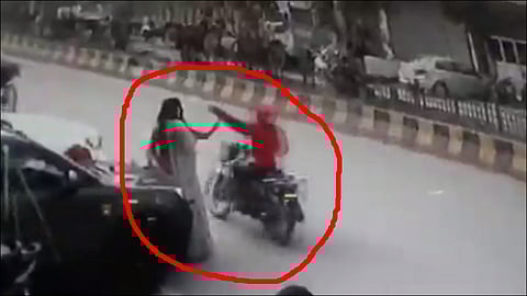 girls selfie on road while mobile being snatched away by biker video viral