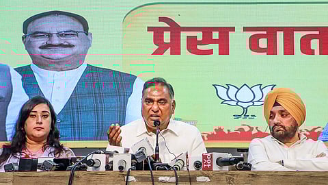 BJP MPs Ramvir Singh Bidhuri and Bansuri Swaraj with party leader Arvinder Singh Lovely during a press conference at party office, in New Delhi