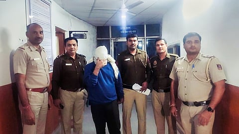 Delhi police officers apprehend Aftab Ameen Poonawala, who is accused of killing his live-in partner Shraddha Walkar, at Mehrauli Police Station, in New Delhi, November 14, 2022