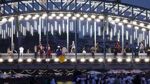 Rain can't dampen spirits at Paris' unique Olympic opening ceremony