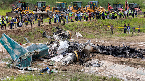 The wreckage of the plane crash as rescue operations are underway in Kathmandu.
