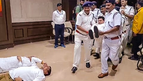 Marshals bring Jharkhand BJP MLAs out of the Jharkhand Legislative Assembly during their protest amid the ongoing Monsoon session, in Ranchi