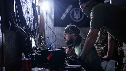 Ukrainian soldiers of 3rd assault brigade fly by an FPV suicide drone over Russian positions in Kharkiv region