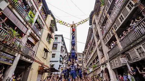 'Govindas' form a human pyramid to break the 'Dahi Handi' on the occasion of Gokulashtami festival