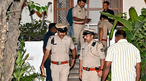 Police personnel investigate after former Karnataka Director General of Police Om Prakash was found dead under mysterious circumstances at his residence