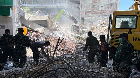 Death toll from Indonesian school collapse rises to 14 as crews pull more bodies from rubble