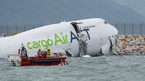 2 dead as cargo plane skids off Hong Kong airport runway into sea