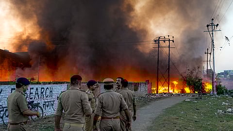 ‘Nothing is left’: Vikas Nagar slum residents sift through charred remains