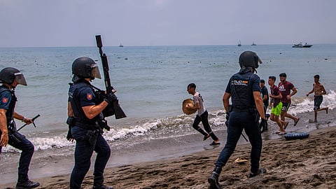 Spain deploys military to Ceuta after thousands of people breach Morocco's border, at least 9 killed