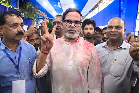 Jan Suraaj Party chief Prashant Kishor flashes the victory sign after taking the lead in the Bankipur Assembly by-election during the counting of votes, in Patna, on Monday | PTI
