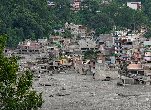Residential buildings covered in thick mud in the aftermath of flash floods, at Trishuli market, in Nuwakot district, on Sunday | PTI