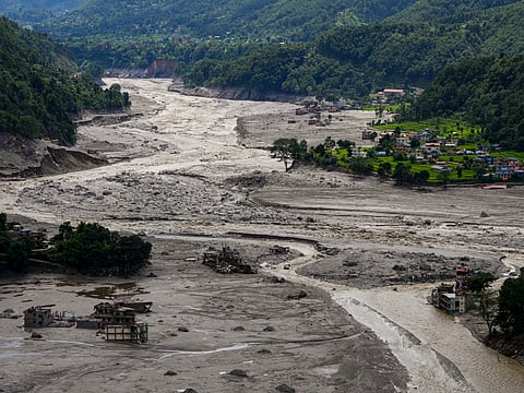 A view of damaged and half-buried buildings under silt and debris following devastating flash floods, at Betrawati market, in Nuwakot district, Nepal | PTI