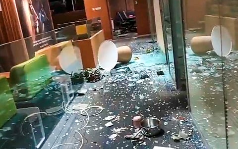 A screengrab from a video shared by TMC leader Abhishek Banerjee shows shattered glass on the floor after an intrusion at his Camac Street office | X