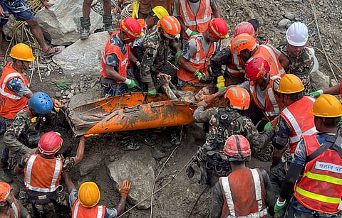 Nepal Army personnel and other officials rescue a man from the tunnel of the Trishuli 3A Hydropower Project, in the aftermath of the recent flash floods, in Rasuwa district | PTI