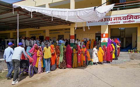 Women wait in a queue to cast votes during the second and final phase of the urban local body elections, at a polling station, in Ajmer district | File image/PTI