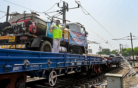 An official sprays insecticides along railway tracks after the MCD along with Northern Railway flagged off the 'Mosquito Terminator Train-2026', in New Delhi | File image/PTI