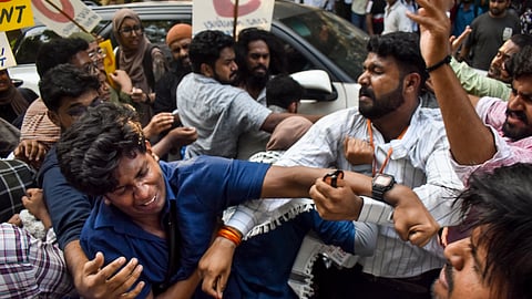 ABVP alleges involvement of outside political workers while NSUI claims tribal student member was attacked, with both sides demanding investigation and action