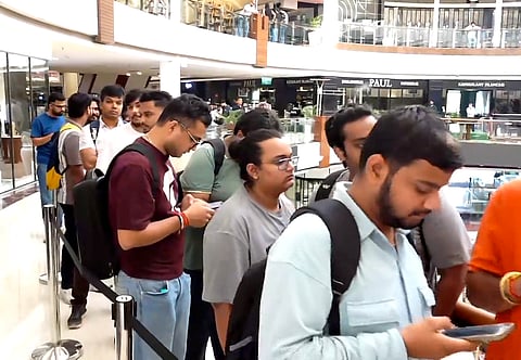 People wait in a queue outside the Apple Store at Select Citywalk Mall during the official sales launch of the iPhone 18 Pro and iPhone 18 Pro Max in India, in New Delhi, on Friday | PTI