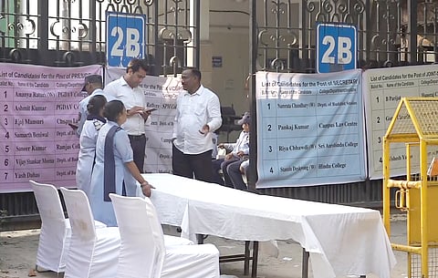 Security personnel and officials during the counting of vote for the Delhi University Students Union elections amid heightened security, in New Delhi, on Saturday | PTI