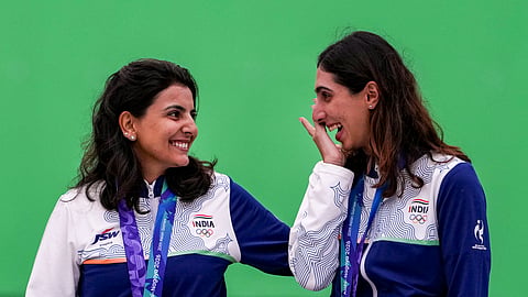 India's Maheshwari Chauhan, left, and Parinaaz Dhaliwal after winning bronze in the Skeet Women Team Final event, during the 20th Asian Games, in Nagoya, Japan