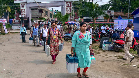 Officials leave for their respective polling stations after collecting election materials ahead of the Nagaon Lok Sabha by-election, in Assam's Nagaon district, on Monday | PTI