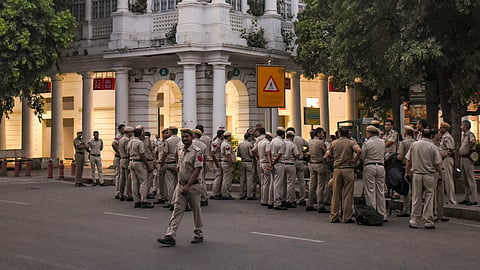 Delhi Police personnel stand guard outside Block A in the Inner Circle of Connaught Place following an anti-CEC protest organised by the Cockroach Janta Party, in New Delhi, on Saturday | PTI